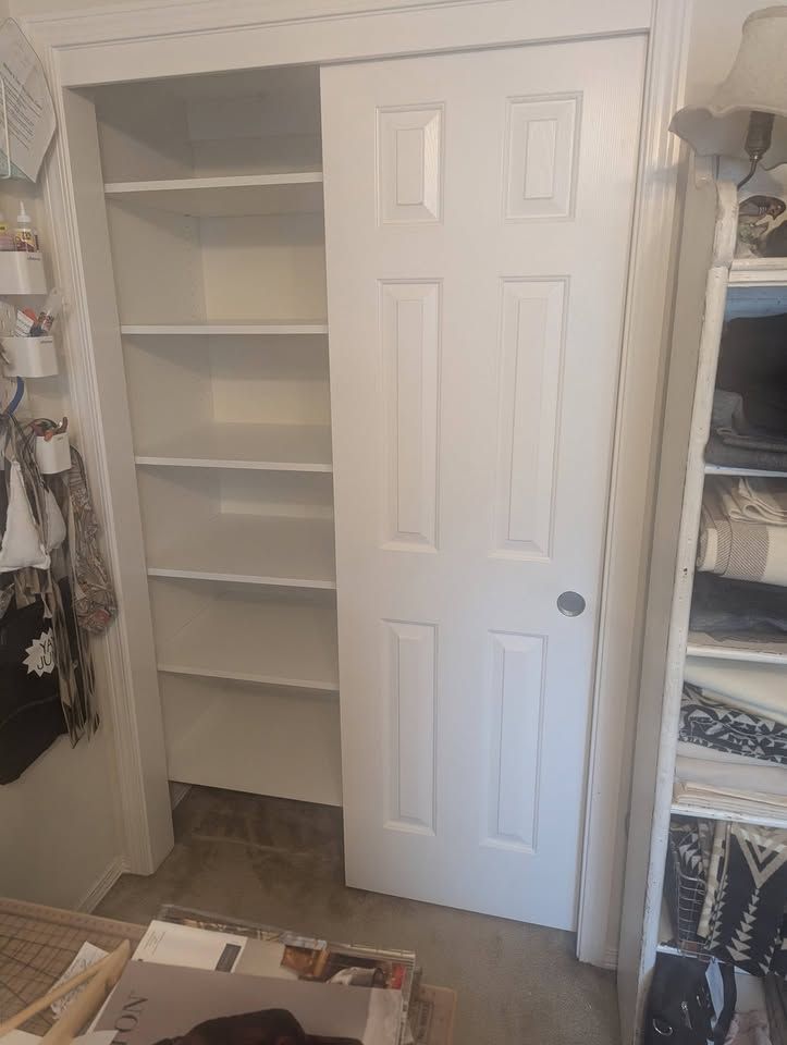 White craft closet, shelf stack, with the bypass door open