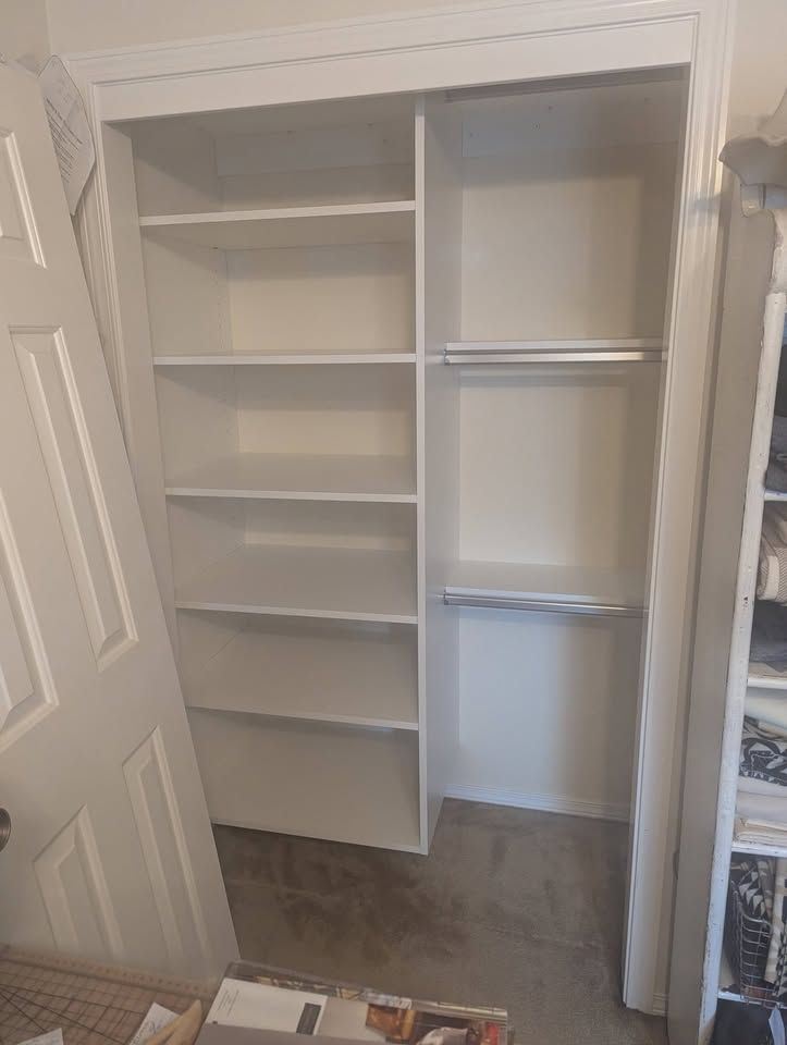 White craft closet with full-depth shelves and triple hang