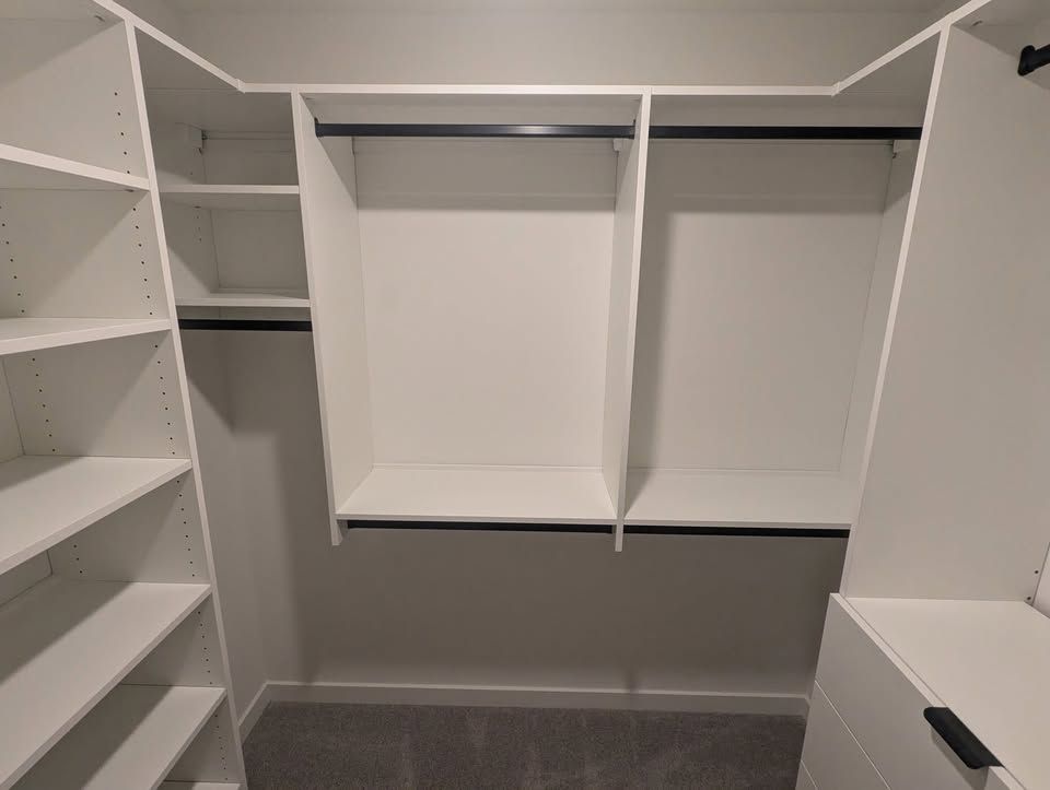 White 7 by 7 closet seen from the center entry