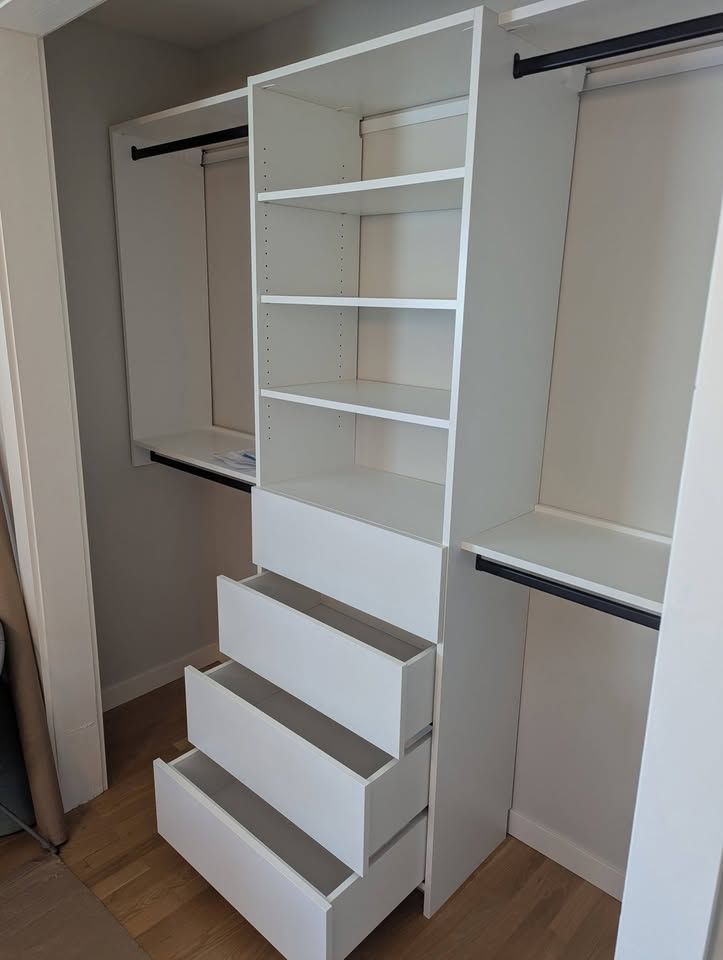 White reach-in closet with the drawer stack open